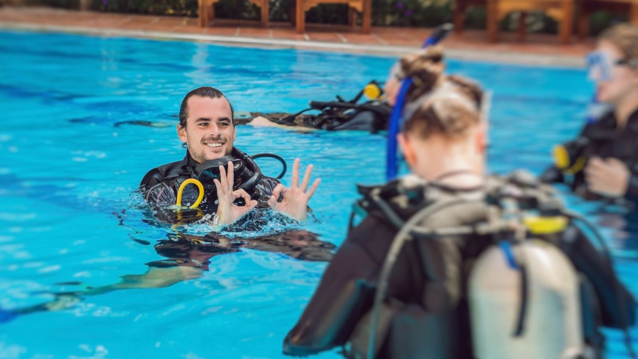 PADI instructor conducting training in a pool, illustrating the benefits of becoming PADI instructor after divemaster.