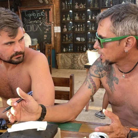 Course Director debriefing with an IDC candidate, showing the personal mentorship that comes with choosing a course director who supports your growth.